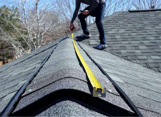 Noblesville roofer measuring a roof